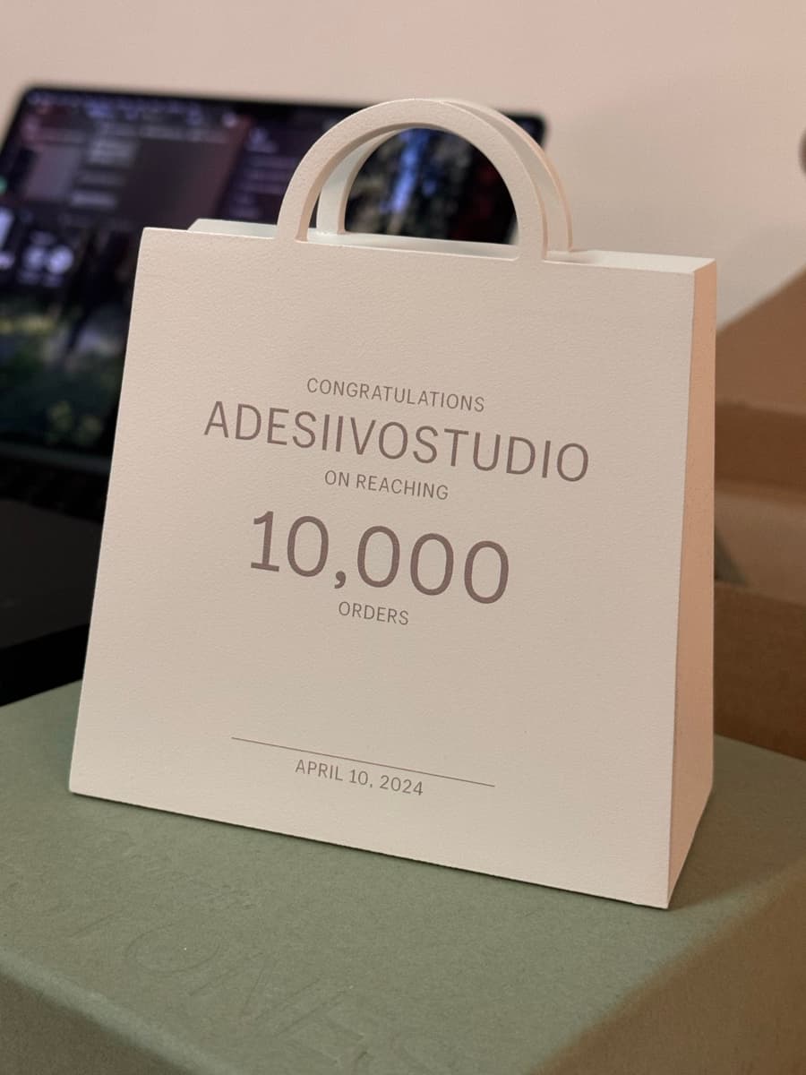 AdesiivoStudio 10,000 orders milestone plaque