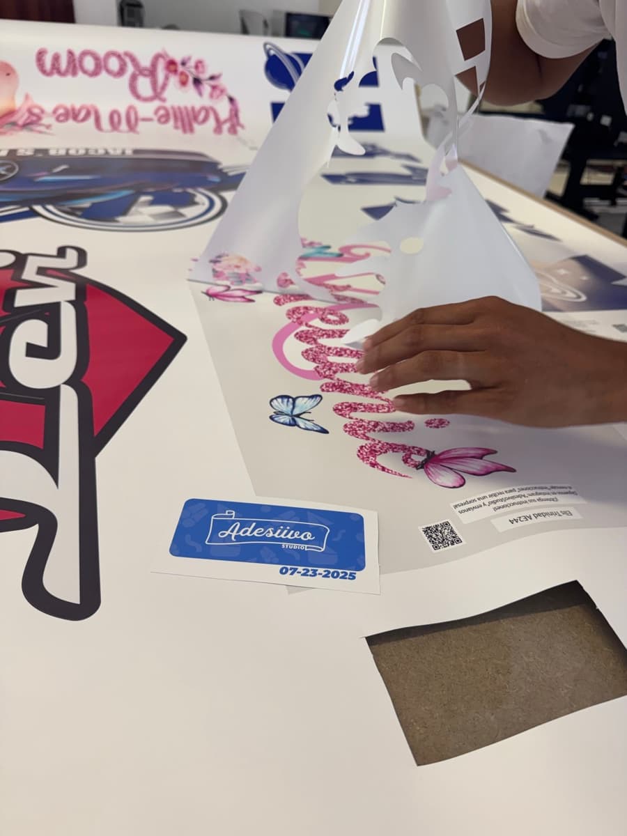 Hand-checking and cutting printed decals on the work table
